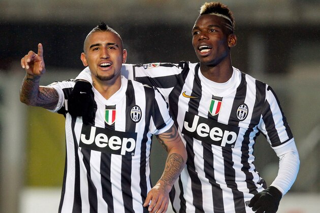 BERGAMO, ITALY - DECEMBER 22:  Arturo Vidal (L) and Paul Pogba of Juventus celebrate the 4th goal during the Serie A match between Atalanta BC and Juventus at Stadio Atleti Azzurri d'Italia on December 22, 2013 in Bergamo, Italy.  (Photo by Maurizio Lagana/Getty Images)