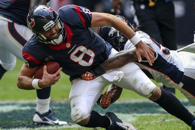 Dec 22, 2013; Houston, TX, USA; Houston Texans quarterback Matt Schaub (8) is sacked during the third quarter by Denver Broncos outside linebacker Danny Trevathan (59) at Reliant Stadium. The Broncos defeated the Texans 37-13. Mandatory Credit: Troy Taormina-USA TODAY Sports