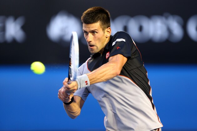 MELBOURNE, AUSTRALIA - JANUARY 13: Novak Djokovic of Serbia plays a backhand in his first round match against Lukas Lacko of Slovakia during day one of the 2014 Australian Open at Melbourne Park on January 13, 2014 in Melbourne, Australia. (Photo by Matt King/Getty Images) MELBOURNE, AUSTRALIA - JANUARY 13: Novak Djokovic of Serbia plays a backhand in his first round match against Lukas Lacko of Slovakia during day one of the 2014 Australian Open at Melbourne Park on January 13, 2014 in Melbourne, Australia. (Photo by Matt King/Getty Images)