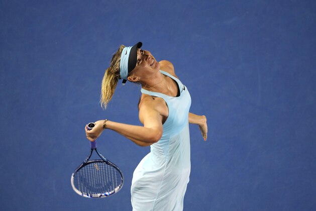 MELBOURNE, AUSTRALIA - JANUARY 14:  Maria Sharapova of Russia serves in her first round match against Bethanie Mattek-Sands of the United States during day two of the 2014 Australian Open at Melbourne Park on January 14, 2014 in Melbourne, Australia.  (Photo by Clive Brunskill/Getty Images)