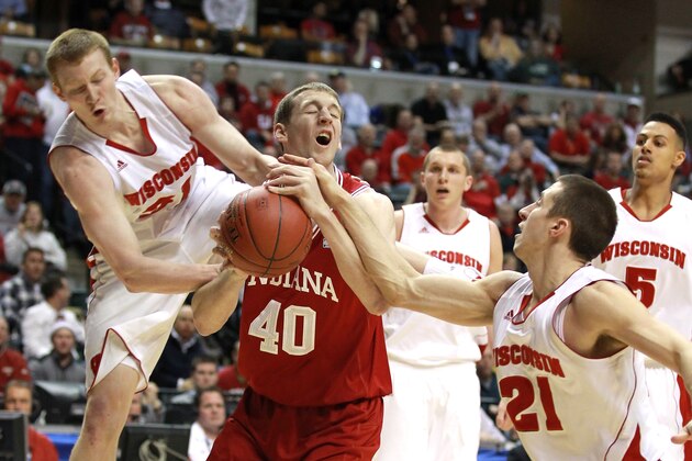 INDIANAPOLIS, IN - MARCH 09: Cody Zeller #40 of the Indiana Hoosiers attempts to control the ball against Mike Bruesewitz #31 and Josh Gasser #21 of the Wisconsin Badgers during their quarterfinal game of 2012 Big Ten Men's Basketball Conferene Tournament at Bankers Life Fieldhouse on March 9, 2012 in Indianapolis, Indiana (Photo by Andy Lyons/Getty Images) INDIANAPOLIS, IN - MARCH 09: Cody Zeller #40 of the Indiana Hoosiers attempts to control the ball against Mike Bruesewitz #31 and Josh Gasser #21 of the Wisconsin Badgers during their quarterfinal game of 2012 Big Ten Men's Basketball Conferene Tournament at Bankers Life Fieldhouse on March 9, 2012 in Indianapolis, Indiana (Photo by Andy Lyons/Getty Images)
