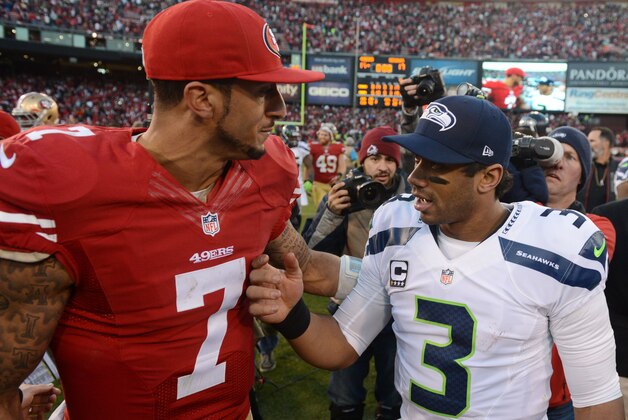 December 8, 2013; San Francisco, CA, USA; San Francisco 49ers quarterback Colin Kaepernick (7) shakes hands with Seattle Seahawks quarterback Russell Wilson (3) after the game at Candlestick Park. The 49ers defeated the Seahawks 19-17. Mandatory Credit: Kyle Terada-USA TODAY Sports