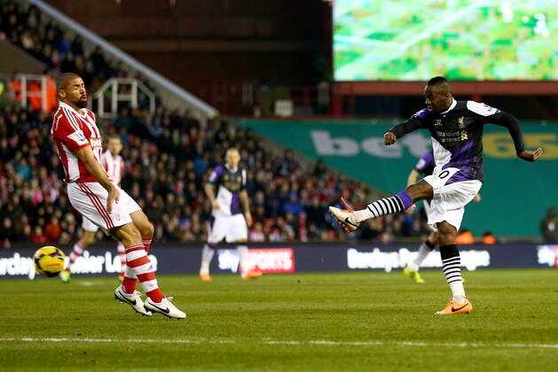 STOKE ON TRENT, ENGLAND - JANUARY 12:  Aly Cissokho of Liverpool shoots as his shot deflects in off Ryan Shawcross of Stoke City for an own goal for their first goal during the Barclays Premier League match between Stoke City and Liverpool at Britannia Stadium on January 12, 2014 in Stoke on Trent, England.  (Photo by Clive Mason/Getty Images)