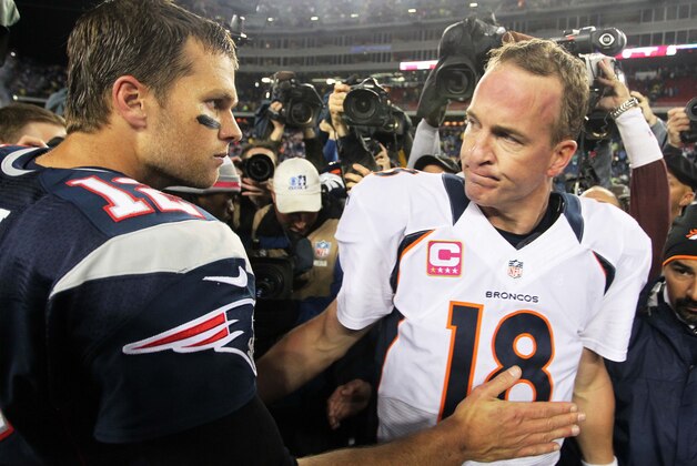 Oct 7, 2012; Foxborough, MA, USA; New England Patriots quarterback Tom Brady (12) shakes hands with Denver Broncos quarterback Peyton Manning (18) following the game at Gillette Stadium. The Patriots defeated the Broncos 31-21. Mandatory Credit: Stew Milne-USA TODAY Sports