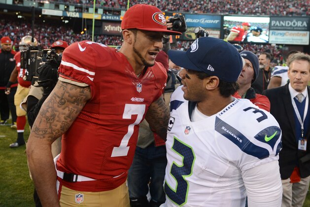 December 8, 2013; San Francisco, CA, USA; San Francisco 49ers quarterback Colin Kaepernick (7) shakes hands with Seattle Seahawks quarterback Russell Wilson (3) after the game at Candlestick Park. The 49ers defeated the Seahawks 19-17. Mandatory Credit: Kyle Terada-USA TODAY Sports