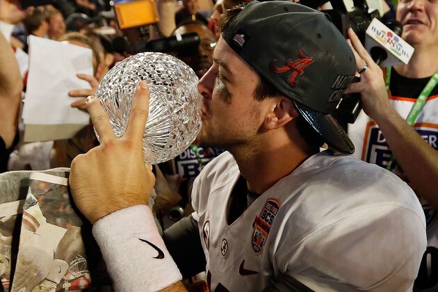 MIAMI GARDENS, FL - JANUARY 07: AJ McCarron #10 of the Alabama Crimson Tide celebrates with the Coach's Trophy after defeating the Notre Dame Fighting Irish by a score of 42-14 to win the 2013 Discover BCS National Championship game at Sun Life Stadium on January 7, 2013 in Miami Gardens, Florida. (Photo by Kevin C. Cox/Getty Images) MIAMI GARDENS, FL - JANUARY 07: AJ McCarron #10 of the Alabama Crimson Tide celebrates with the Coach's Trophy after defeating the Notre Dame Fighting Irish by a score of 42-14 to win the 2013 Discover BCS National Championship game at Sun Life Stadium on January 7, 2013 in Miami Gardens, Florida. (Photo by Kevin C. Cox/Getty Images)