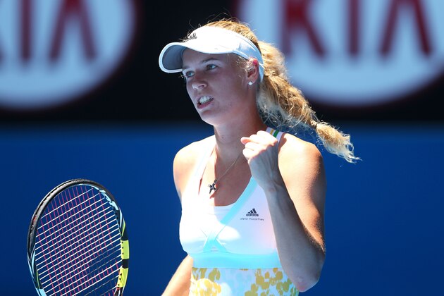 MELBOURNE, AUSTRALIA - JANUARY 14: Caroline Wozniacki of Denmark celebrates winning her first round match against Lourdes Dominguez Lino of Spain during day two of the 2014 Australian Open at Melbourne Park on January 14, 2014 in Melbourne, Australia. (Photo by Quinn Rooney/Getty Images) MELBOURNE, AUSTRALIA - JANUARY 14: Caroline Wozniacki of Denmark celebrates winning her first round match against Lourdes Dominguez Lino of Spain during day two of the 2014 Australian Open at Melbourne Park on January 14, 2014 in Melbourne, Australia. (Photo by Quinn Rooney/Getty Images)