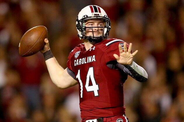 COLUMBIA, SC - NOVEMBER 16:  Connor Shaw #14 of the South Carolina Gamecocks drops back to pass against the Florida Gators during their game at Williams-Brice Stadium on November 16, 2013 in Columbia, South Carolina.  (Photo by Streeter Lecka/Getty Images)