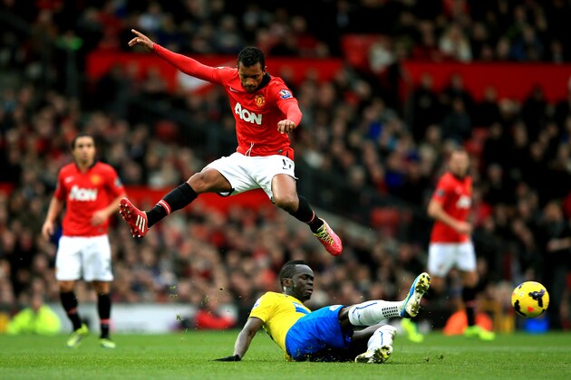 MANCHESTER, ENGLAND - DECEMBER 07:  Nani of Manchester United hurrdles the tackle from Cheik Ismael Tiote of Newcastle during the Barclays Premier League match between Manchester United and Newcastle United at Old Trafford on December 7, 2013 in Manchester, England.  (Photo by Richard Heathcote/Getty Images)