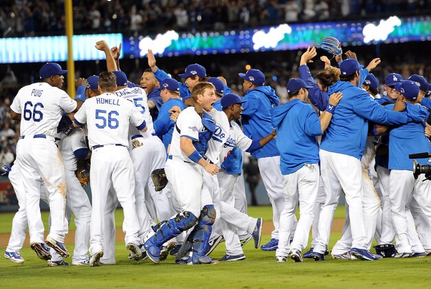 Oct 7, 2013; Los Angeles, CA, USA; The Los Angeles Dodgers celebrate defeating the Atlanta Braves 3-2 in game four of the National League divisional series at Dodger Stadium. Dodgers won 3-2. Mandatory Credit: Jayne Kamin-Oncea-USA TODAY Sports Oct 7, 2013; Los Angeles, CA, USA; The Los Angeles Dodgers celebrate defeating the Atlanta Braves 3-2 in game four of the National League divisional series at Dodger Stadium. Dodgers won 3-2. Mandatory Credit: Jayne Kamin-Oncea-USA TODAY Sports