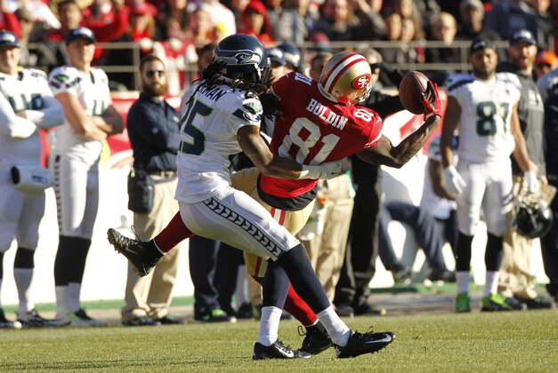 Dec 8, 2013; San Francisco, CA, USA; San Francisco 49ers wide receiver Anquan Boldin (81) makes a catch next to Seattle Seahawks cornerback Richard Sherman (25) in the second quarter at Candlestick Park. Mandatory Credit: Cary Edmondson-USA TODAY Sports