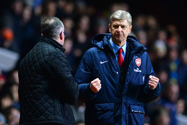 BIRMINGHAM, ENGLAND - JANUARY 13: Arsene Wenger manager of Arsenal reacts at the final whistle as he turns to Manager Paul Lambert of Aston Villa during the Barclays Premier League match between Aston Villa and Arsenal at Villa Park on January 13, 2014 in Birmingham, England. (Photo by Michael Regan/Getty Images) BIRMINGHAM, ENGLAND - JANUARY 13: Arsene Wenger manager of Arsenal reacts at the final whistle as he turns to Manager Paul Lambert of Aston Villa during the Barclays Premier League match between Aston Villa and Arsenal at Villa Park on January 13, 2014 in Birmingham, England. (Photo by Michael Regan/Getty Images)