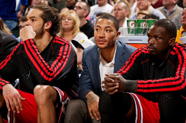 INDIANAPOLIS, IN - MARCH 3: Derrick Rose #1 of the Chicago Bulls, wearing street clothes, sits on the bench with teammates Joakim Noah #13 and Luol Deng #9 during a game against the Indiana Pacers on March 3, 2013 at Bankers Life Fieldhouse in Indianapolis, Indiana.  NOTE TO USER: User expressly acknowledges and agrees that, by downloading and or using this photograph, user is consenting to the terms and condition of the Getty Images License Agreement. Mandatory Copyright Notice: 2013 NBAE  (Photo by Ron Hoskins/NBAE via Getty Images)