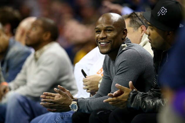 CHARLOTTE, NC - DECEMBER 14: Professional boxer Floyd Mayweather Jr. watches on during the game between the Los Angeles Lakers and Charlotte Bobcats at Time Warner Cable Arena on December 14, 2013 in Charlotte, North Carolina. NOTE TO USER: User expressly acknowledges and agrees that, by downloading and or using this photograph, User is consenting to the terms and conditions of the Getty Images License Agreement. (Photo by Streeter Lecka/Getty Images) CHARLOTTE, NC - DECEMBER 14: Professional boxer Floyd Mayweather Jr. watches on during the game between the Los Angeles Lakers and Charlotte Bobcats at Time Warner Cable Arena on December 14, 2013 in Charlotte, North Carolina. NOTE TO USER: User expressly acknowledges and agrees that, by downloading and or using this photograph, User is consenting to the terms and conditions of the Getty Images License Agreement. (Photo by Streeter Lecka/Getty Images)