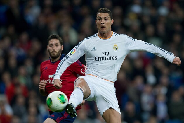 MADRID, SPAIN - JANUARY 09: Cristiano Ronaldo of Real Madrid CF strikes the ball during the Copa del Rey Round of 8 first match between Real Madrid and CA Osasuna at Estadio Santiago Bernabeu on January 9, 2014 in Madrid, Spain.  (Photo by Gonzalo Arroyo Moreno/Getty Images)