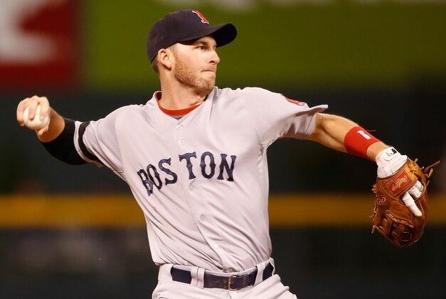Sep 24, 2013; Denver, CO, USA; Boston Red Sox shortstop Stephen Drew (7) fields a ground ball during the eighth inning against the Colorado Rockies at Coors Field. The Rockies won 8-3.  Mandatory Credit: Chris Humphreys-USA TODAY Sports