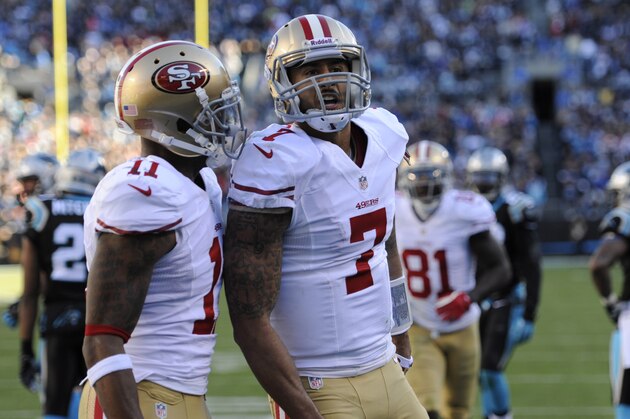 Jan 12, 2014; Charlotte, NC, USA; San Francisco 49ers quarterback Colin Kaepernick (7) celebrates a touchdown with wide receiver Quinton Patton (11) against the Carolina Panthers during the third quarter of the 2013 NFC divisional playoff football game at Bank of America Stadium. Mandatory Credit: Sam Sharpe-USA TODAY Sports Jan 12, 2014; Charlotte, NC, USA; San Francisco 49ers quarterback Colin Kaepernick (7) celebrates a touchdown with wide receiver Quinton Patton (11) against the Carolina Panthers during the third quarter of the 2013 NFC divisional playoff football game at Bank of America Stadium. Mandatory Credit: Sam Sharpe-USA TODAY Sports