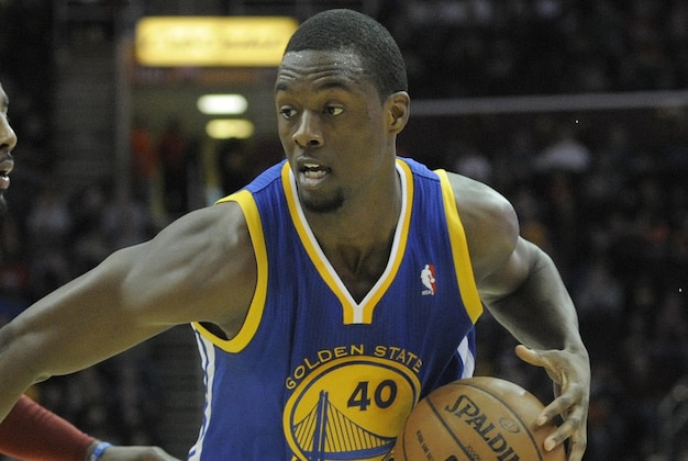 Dec 29, 2013; Cleveland, OH, USA; Golden State Warriors small forward Harrison Barnes (40) dribbles the ball around Cleveland Cavaliers point guard Kyrie Irving (2) in the second quarter at Quicken Loans Arena. Mandatory Credit: David Richard-USA TODAY Sports