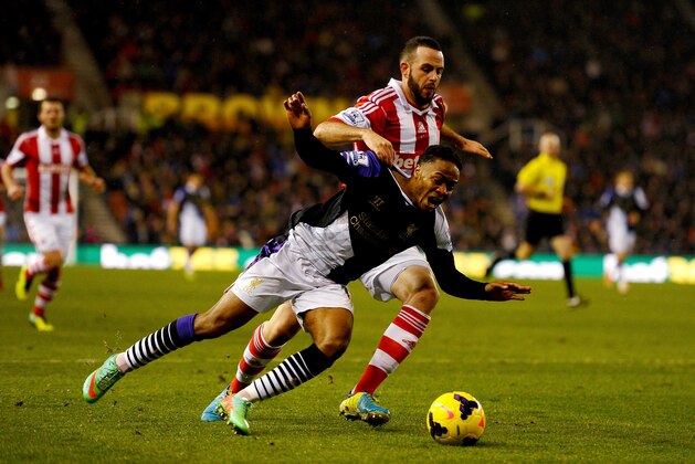 STOKE ON TRENT, ENGLAND - JANUARY 12:  Raheem Sterling of Liverpool is fouled by Marc Wilson of Stoke City for a penalty kick during the Barclays Premier League match between Stoke City and Liverpool at Britannia Stadium on January 12, 2014 in Stoke on Trent, England.  (Photo by Laurence Griffiths/Getty Images)