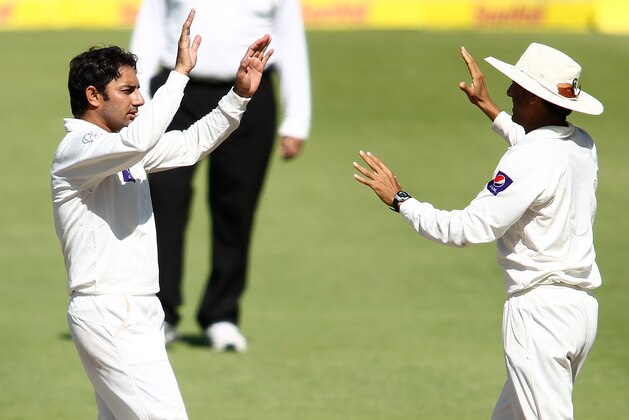 CAPE TOWN, SOUTH AFRICA - FEBRUARY 17:  Saeed Ajmal of Pakistan is congratulated by Younis Khan of Pakistan after getting thw wicket of Jacques Kallis of South Africa during day 4 of the 2nd Sunfoil Test match between South Africa and Pakistan at Sahara Park Newlands on February 17, 2013 in Cape Town, South Africa. (Photo by Shaun Roy/Gallo Images/Getty Images)