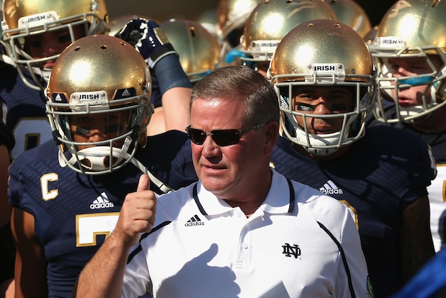 SOUTH BEND, IN - SEPTEMBER 28:  Head coach Brian Kelly of the Notre Dame Fighting Irish waits torun onto the field with his team before a game against the Oklahoma Sooners at Notre Dame Stadium on September 28, 2013 in South Bend, Indiana. Oklahoma defeated Notre Dame 35-21.  (Photo by Jonathan Daniel/Getty Images)