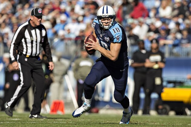 NASHVILLE, TN - NOVEMBER 10:  Jake Locker #10 of the Tennessee Titans runs the ball against the Jacksonville Jaguars at LP Field on November 10, 2013 in Nashville, Tennessee.  The Jaguars defeated the Titans 29-27.  (Photo by Wesley Hitt/Getty Images)