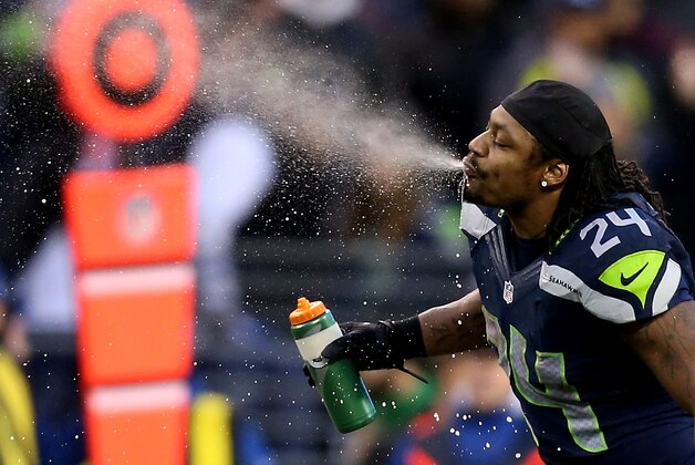 SEATTLE, WA - JANUARY 11: Running back Marshawn Lynch #24 of the Seattle Seahawks spits out water in the fourth quarter while taking on the New Orleans Saints during the NFC Divisional Playoff Game at CenturyLink Field on January 11, 2014 in Seattle, Washington. (Photo by Jeff Gross/Getty Images) SEATTLE, WA - JANUARY 11: Running back Marshawn Lynch #24 of the Seattle Seahawks spits out water in the fourth quarter while taking on the New Orleans Saints during the NFC Divisional Playoff Game at CenturyLink Field on January 11, 2014 in Seattle, Washington. (Photo by Jeff Gross/Getty Images)