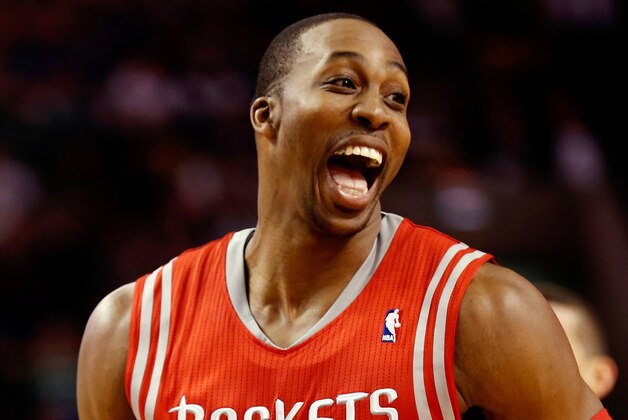 Jan 13, 2014; Boston, MA, USA; Houston Rockets power forward Dwight Howard (12) has a laugh with teammates during the first quarter of their 104-92 win over the Boston Celtics at TD Garden. Mandatory Credit: Winslow Townson-USA TODAY Sports