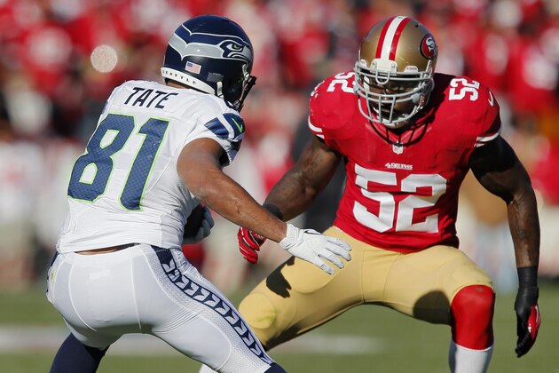 SAN FRANCISCO, CA - DECEMBER 08:  Linebacker Patrick Willis #52 of the San Francisco 49ers blocks the path of wide receiver Golden Tate #81 of the Seattle Seahawks on a 4-yard catch in the first quarter on December 8, 2013 at Candlestick Park in San Francisco, California.  The 49ers won 19-17.  (Photo by Brian Bahr/Getty Images)