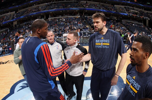 MEMPHIS, TN - JANUARY 14: Marc Gasol #33 and Mike Conley #11 of the Memphis Grizzlies greet Kevin Durant #35 of the Oklahoma City Thunder before a game on January 14, 2014 at FedExForum in Memphis, Tennessee. NOTE TO USER: User expressly acknowledges and agrees that, by downloading and or using this photograph, User is consenting to the terms and conditions of the Getty Images License Agreement. Mandatory Copyright Notice: Copyright 2014 NBAE (Photo by Joe Murphy/NBAE via Getty Images)