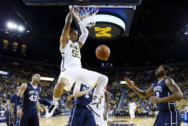 Jan 14, 2014; Ann Arbor, MI, USA; Michigan Wolverines forward Jordan Morgan (52) reacts as he makes a dunk in the first half against the Penn State Nittany Lions at Crisler Arena. Mandatory Credit: Rick Osentoski-USA TODAY Sports