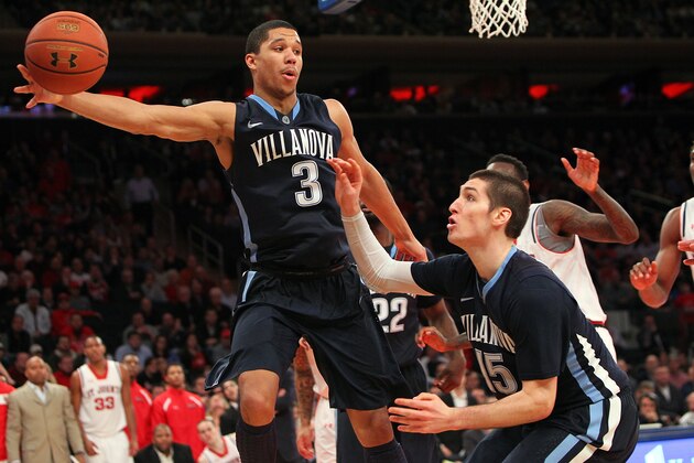 NEW YORK, NY - JANUARY 11: Josh Hart #3 of the Villanova Wildcats reaches to keep the ball in bounds with teamate Ryan Arcidiacono #15 during the game against the St. John's Red Storm during the game at Madison Square Garden on January 11, 2014 in New York City. (Photo by Nate Shron/Getty Images)