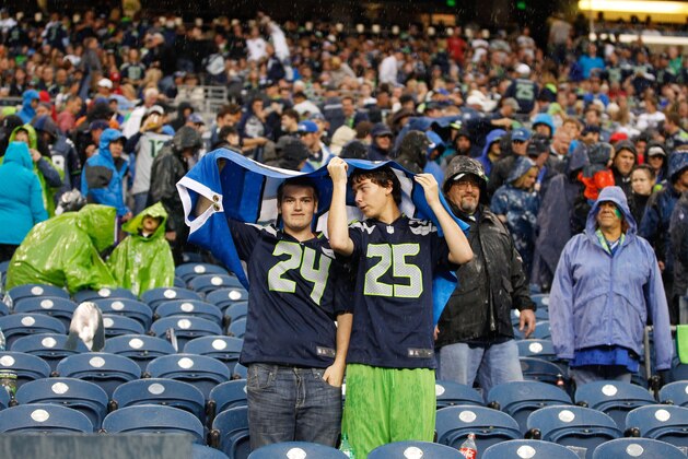SEATTLE, WA - SEPTEMBER 15:  Fans prepare to leave the field due to a rain delay during the game between the Seattle Seahawks and the San Francisco 49ers at CenturyLink Field on September 15, 2013 in Seattle, Washington.  (Photo by Otto Greule Jr/Getty Images)