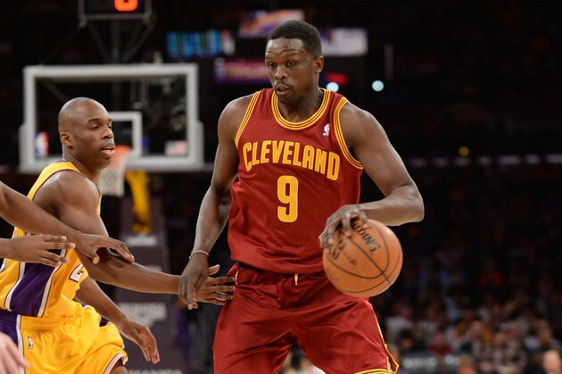 LOS ANGELES, CA - JANUARY 14: Luol Deng #9 of the Cleveland Cavaliers drives to the basket Jodie Meeks #20 of the Los Angeles Lakers at Staples Center on January 14, 2014 in Los Angeles, California. NOTE TO USER: User expressly acknowledges and agrees that, by downloading and/or using this Photograph, user is consenting to the terms and conditions of the Getty Images License Agreement. Mandatory Copyright Notice: Copyright 2014 NBAE (Photo by Noah Graham/NBAE via Getty Images)