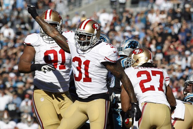 Jan 12, 2014; Charlotte, NC, USA; San Francisco 49ers strong safety Donte Whitner (31) reacts after a defensive stop against the Carolina Panthers at the goal line during the first half of the 2013 NFC divisional playoff football game at Bank of America Stadium. Mandatory Credit: Jeremy Brevard-USA TODAY Sports