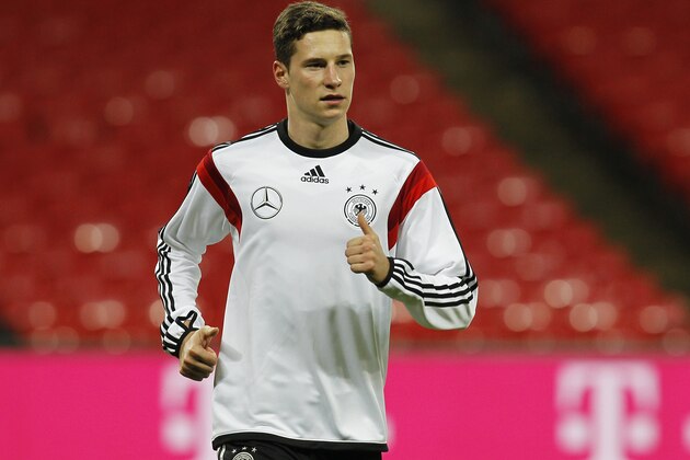 LONDON, ENGLAND - NOVEMBER 18: Julian Draxler of Germany warms up during a training session at Wembley Stadium ahead of their International Friendly against England on November 18, 2013 in London, England. (Photo by Charlie Crowhurst/Getty Images)