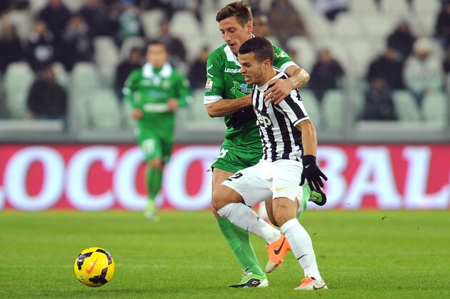 TURIN, ITALY - DECEMBER 18:  Sebastian Giovinco (R) of Juventus is challenged by Eros Schiavon of US Avellino during the Tim Cup match between Juventus and US Avellino at Juventus Arena on December 18, 2013 in Turin, Italy.  (Photo by Valerio Pennicino/Getty Images)