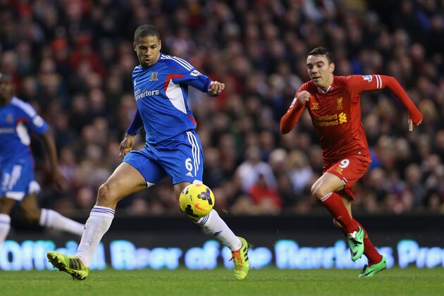 LIVERPOOL, ENGLAND - JANUARY 01: Curtis Davies of Hull City attempts to clear the ball from Iago Aspas of Liverpool during the Barclays Premier League match between Liverpool and Hull City at Anfield on January 1, 2014 in Liverpool, England. (Photo by Clive Brunskill/Getty Images) LIVERPOOL, ENGLAND - JANUARY 01: Curtis Davies of Hull City attempts to clear the ball from Iago Aspas of Liverpool during the Barclays Premier League match between Liverpool and Hull City at Anfield on January 1, 2014 in Liverpool, England. (Photo by Clive Brunskill/Getty Images)