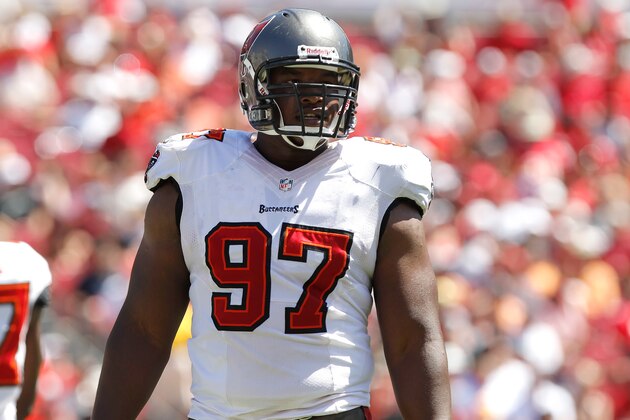 Sep 29, 2013; Tampa, FL, USA; Tampa Bay Buccaneers defensive tackle Akeem Spence (97) against the Arizona Cardinals during the first quarter at Raymond James Stadium. Mandatory Credit: Kim Klement-USA TODAY Sports