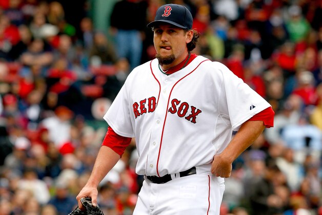 BOSTON, MA - APRIL 13: Joel Hanrahan #52 of the Boston Red Sox is relieved in the ninth inning after walking two Tampa Bay Rays batters at Fenway Park on April 13, 2013 in Boston, Massachusetts. (Photo by Jim Rogash/Getty Images) BOSTON, MA - APRIL 13: Joel Hanrahan #52 of the Boston Red Sox is relieved in the ninth inning after walking two Tampa Bay Rays batters at Fenway Park on April 13, 2013 in Boston, Massachusetts. (Photo by Jim Rogash/Getty Images)