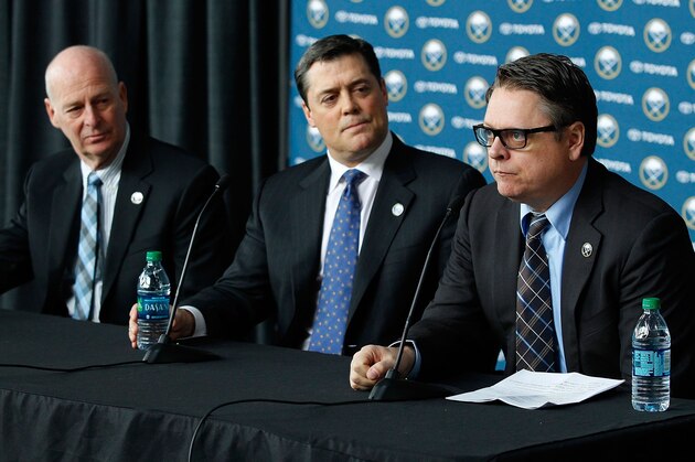 BUFFALO, NY - JANUARY 09:  Tim Murray  (R) speaks at a media conference introducing him as the new general manager of the Buffalo Sabres on January 9, 2014 at the First Niagara Center in Buffalo, New York. With him are Craig Patrick (L), named special assistant and advisor to the hockey department and team president of hockey operations Pat LaFontaine (C).  (Photo by Bill Wippert/NHLI via Getty Images)