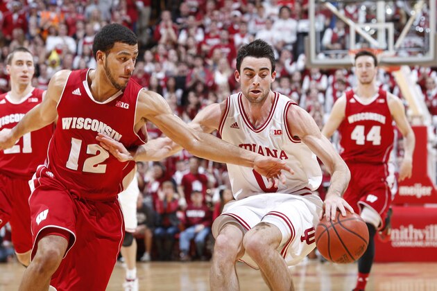 BLOOMINGTON, IN - JANUARY 14:  Will Sheehey #0 of the Indiana Hoosiers drives to the basket against Traevon Jackson #12 of the Wisconsin Badgers during the game at Assembly Hall on January 14, 2014 in Bloomington, Indiana. Indiana won the game 75-72. (Photo by Joe Robbins/Getty Images)