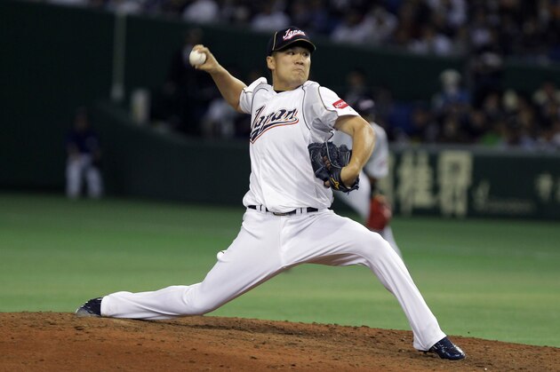 TOKYO, JAPAN - MARCH 12:  Pitcher Masahiro Tanaka # 17 of Japan pitches in the fifth inning during the World Baseball Classic Second Round Pool 1 game between Japan and the Netherlands at Tokyo Dome on March 12, 2013 in Tokyo, Japan.  (Photo by Chung Sung-Jun/Getty Images)
