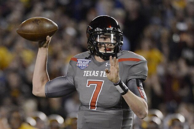 SAN DIEGO, CA - DECEMBER 30:  Davis Webb #7 of the Texas Tech Red Raiders throws a touchdown pass against the Arizona State Sun Devils during the National University Holiday Bowl Game on December 30, 2013 at Qualcomm Stadium in San Diego, California. (Photo by Donald Miralle/Getty Images)
