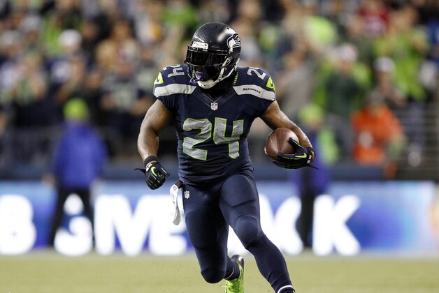 Sep 15, 2013; Seattle, WA, USA; Seattle Seahawks running back Marshawn Lynch (24) runs for yardage after making a reception against the San Francisco 49ers during the second quarter at CenturyLink Field. Mandatory Credit: Joe Nicholson-USA TODAY Sports