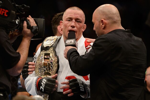 Mar 16, 2013; Montreal, Quebec, CAN;  Georges St.Pierre gives an interview to Joe Rogan after defeating Nick Diaz (not pictured) in their Welterweight title bout at UFC 158 at the Bell Centre. Mandatory Credit: Eric Bolte-USA TODAY Sports