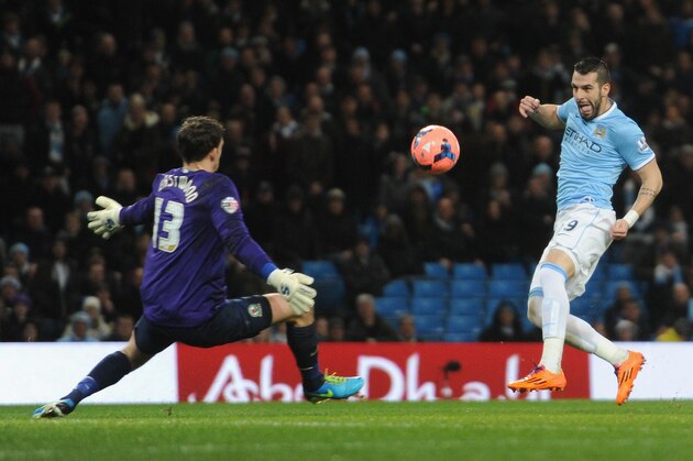 MANCHESTER, ENGLAND - JANUARY 15:  Alvaro Negredo of Manchester City scores the second goal past Simon Eastwood of Blackburn Rovers during the Budweiser FA Cup Third Round Replay match between Manchester City and Blackburn Rovers at the Etihad Stadium on January 15, 2014 in Manchester, England.  (Photo by Chris Brunskill/Getty Images)