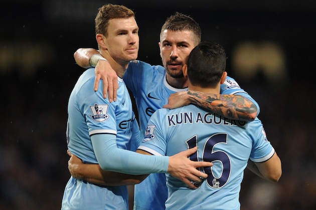 MANCHESTER, ENGLAND - JANUARY 15: Sergio Aguero of Manchester City celebrates scoring his team's fourth goal with team-mates Edin Dzeko (L) and Aleksandar Kolarov during the Budweiser FA Cup Third Round Replay match between Manchester City and Blackburn Rovers at the Etihad Stadium on January 15, 2014 in Manchester, England. (Photo by Chris Brunskill/Getty Images) MANCHESTER, ENGLAND - JANUARY 15: Sergio Aguero of Manchester City celebrates scoring his team's fourth goal with team-mates Edin Dzeko (L) and Aleksandar Kolarov during the Budweiser FA Cup Third Round Replay match between Manchester City and Blackburn Rovers at the Etihad Stadium on January 15, 2014 in Manchester, England. (Photo by Chris Brunskill/Getty Images)