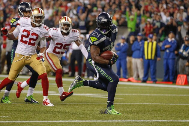 SEATTLE, WA - SEPTEMBER 15:  Running back Marshawn Lynch #24 of the Seattle Seahawks rushes for a touchdown in the third quarter against the San Francisco 49ers at CenturyLink Field on September 15, 2013 in Seattle, Washington.  (Photo by Otto Greule Jr/Getty Images)