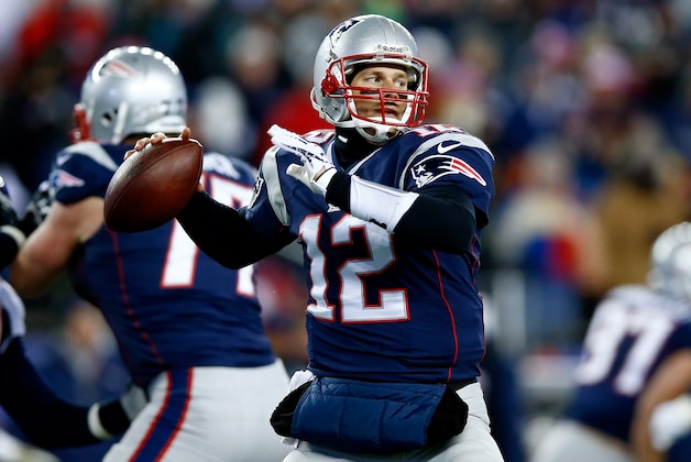 FOXBORO, MA - NOVEMBER 24:  Quarterback Tom Brady #12 of the New England Patriots looks to pass against the Denver Broncos during a game at Gillette Stadium on November 24, 2013 in Foxboro, Massachusetts.  (Photo by Jared Wickerham/Getty Images)